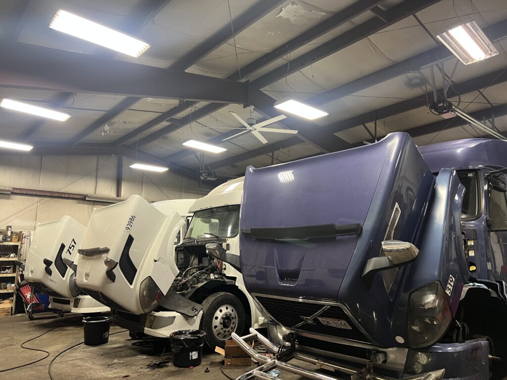 3 trucks in shop all having engine repaired.