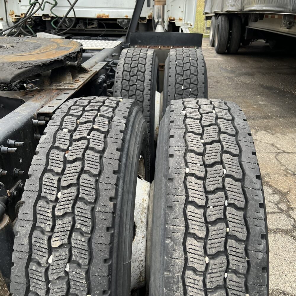 Rear tandem axle tires on Volvo semi truck.