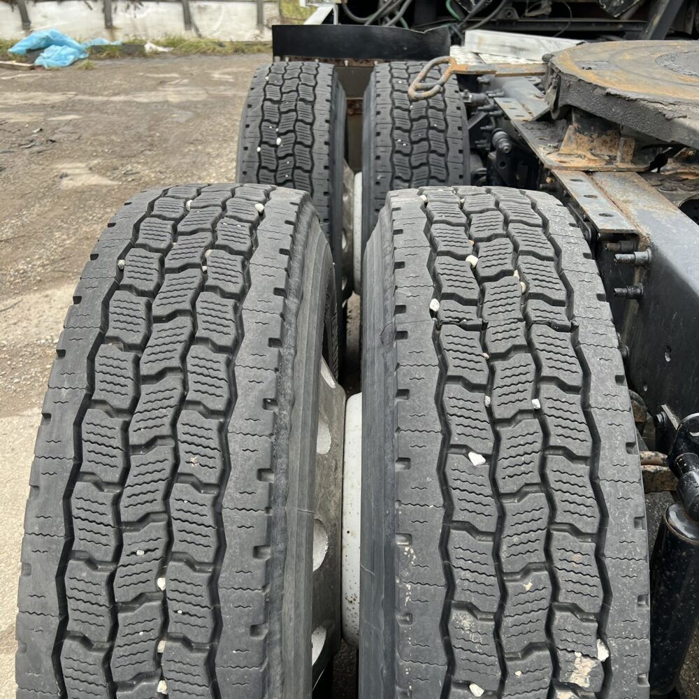 Rear tandem axle tires on Volvo semi truck.