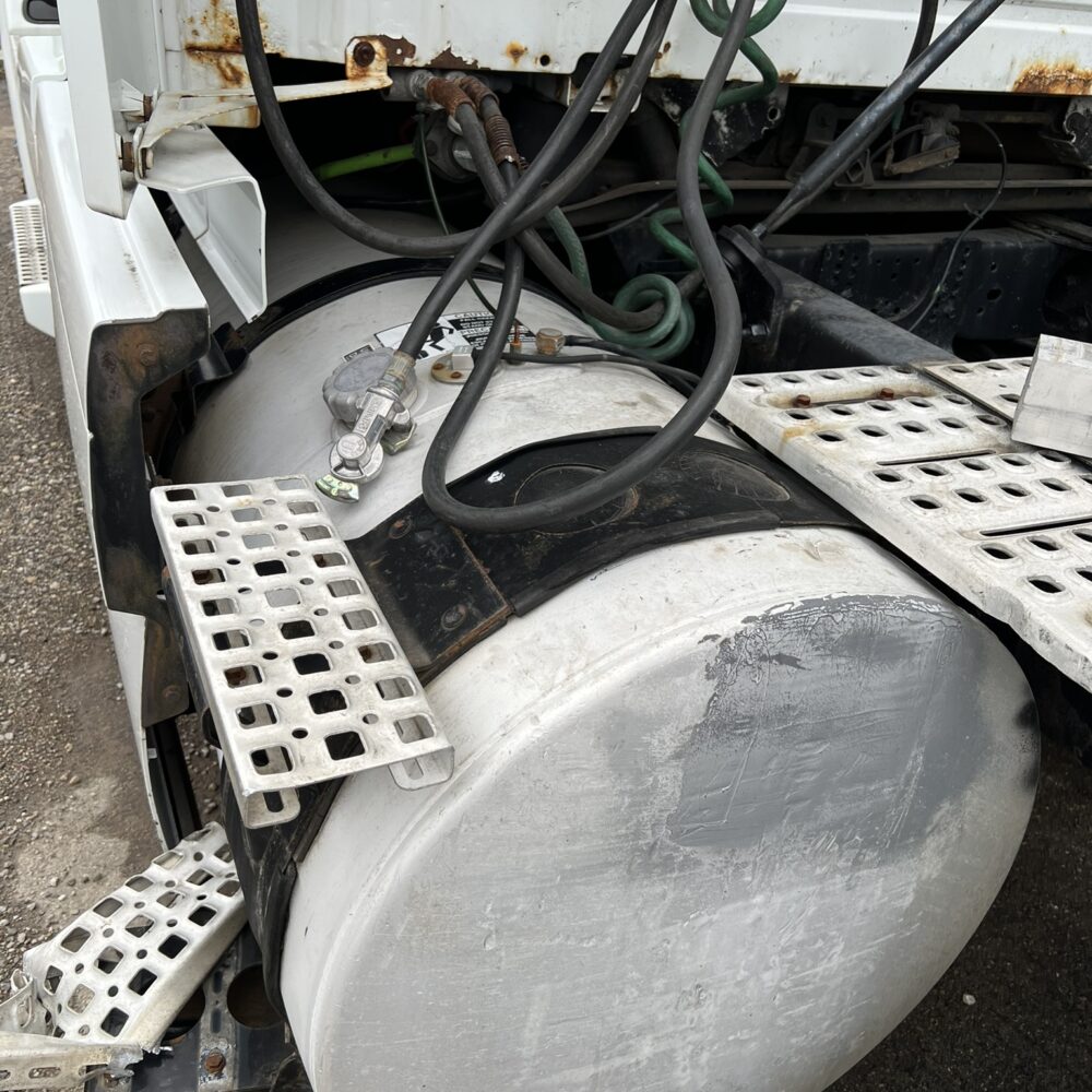 Rear view of driver side fuel tank and steps.